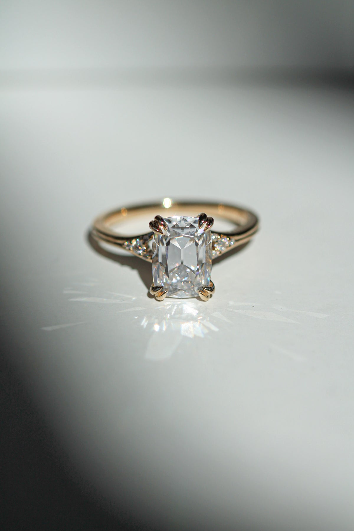 old mine cut elongated cushion diamond in a yellow gold engagement ring (view 6)