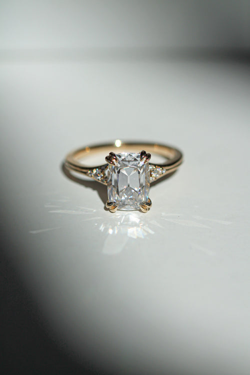 old mine cut elongated cushion diamond in a yellow gold engagement ring (view 2)