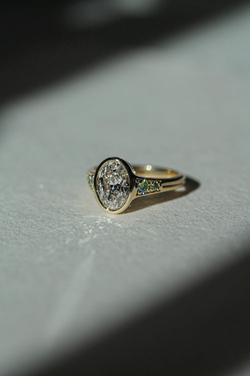 2.00 ct oval diamond Green diamond sidestones