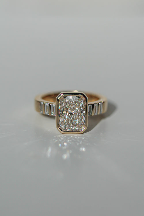 2.57 ct radiant Flush baguette sidestones