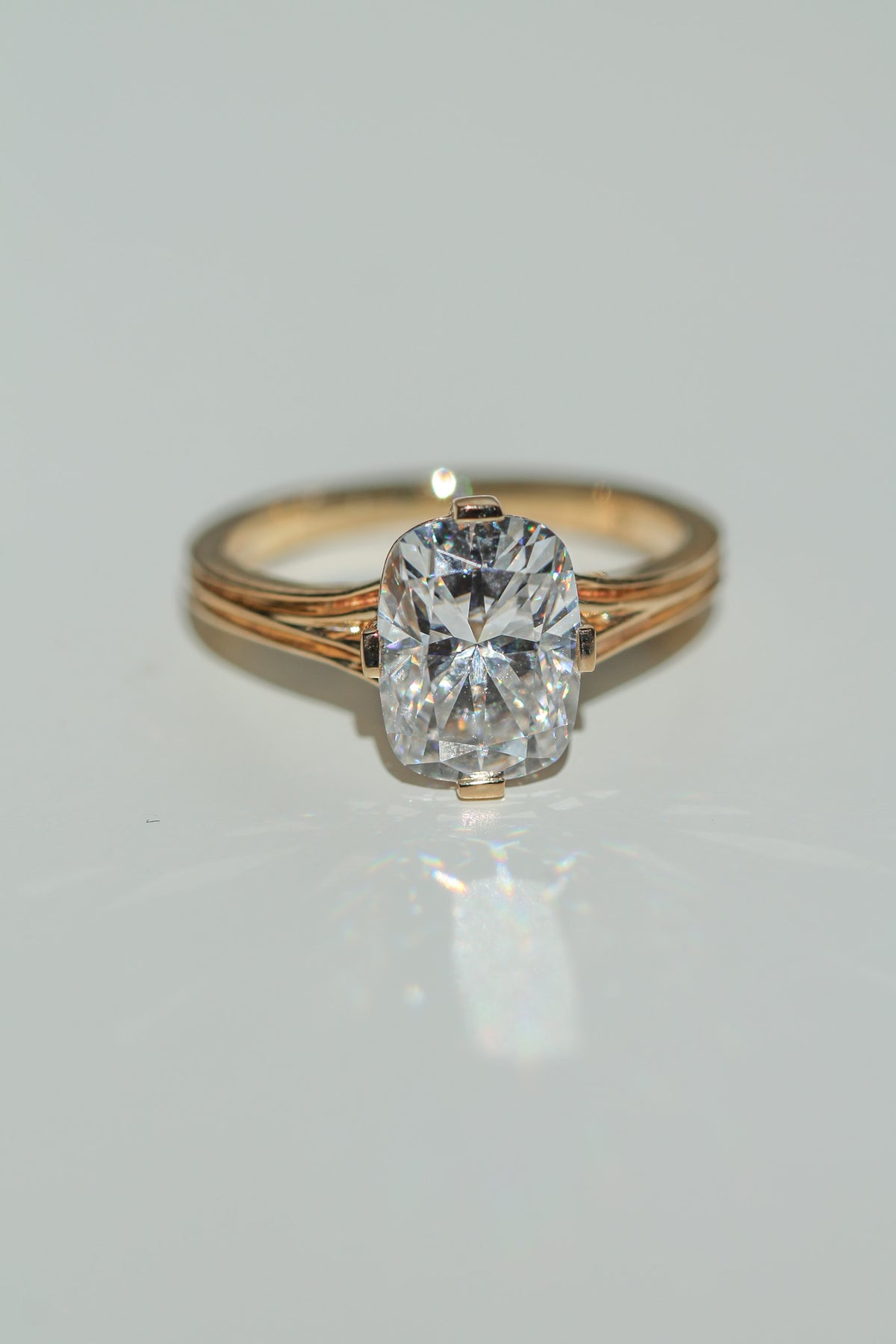 Brilliant cut elongated cushion diamond ring on a white background (view 4)