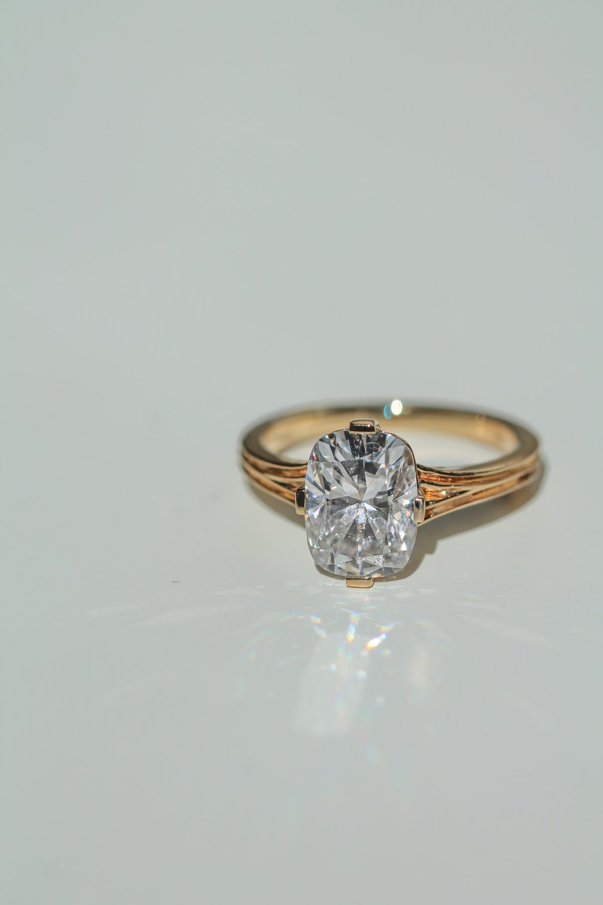 Brilliant cut elongated cushion diamond ring on a white background (view 5)