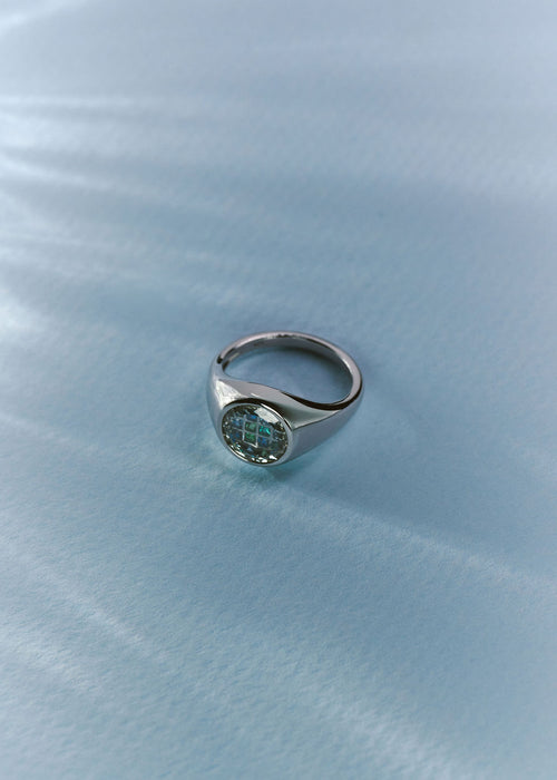 A silver signet ring with a round face and gemstones in blue-green shades. (view 6)
